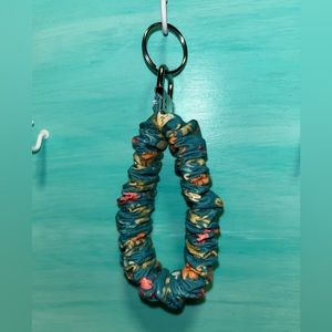 Scrunchy keychain with stretch band.